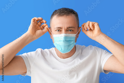 Mature man in medical mask ...