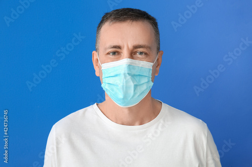 Mature man in medical mask ...