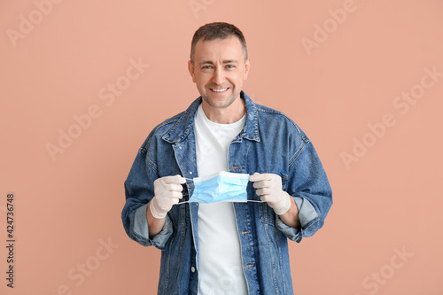 Mature man with medical mas...