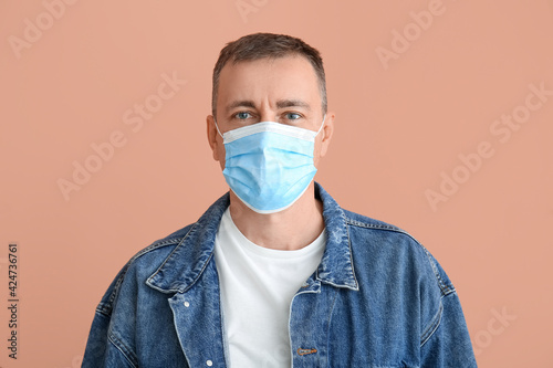 Mature man in medical mask ...