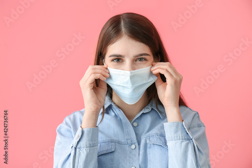 Young woman in medical mask...