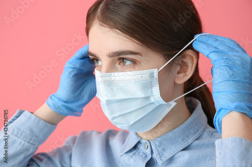 Young woman in medical mask...