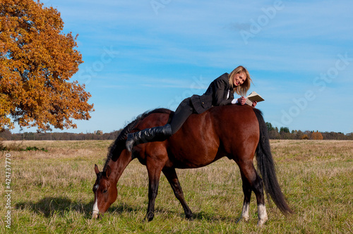 beautiful woman walking with horse