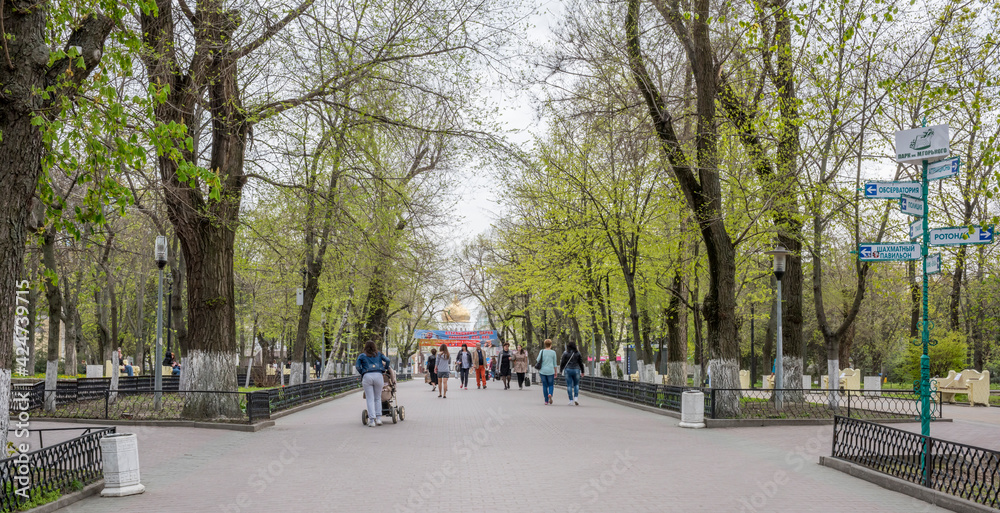  In the spring Gorky Park citizens walk and rest on the benches