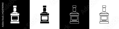 Set Whiskey bottle icon isolated on black and white background. Vector