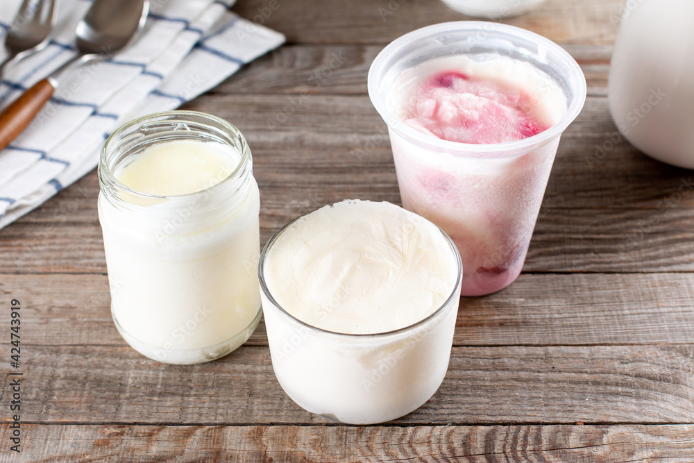 Frozen dairy products. Frozen sour cream. Frozen yogurt on a table Frozen dairy products. Frozen sour cream. Frozen yogurt on a table