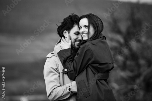Beautiful sensual portrait of young stylish couple in love. Image of adorable brunette couple in love. Happy family.