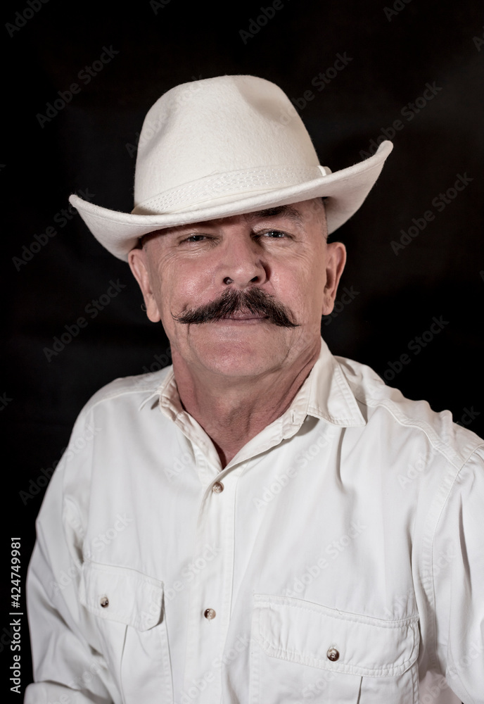The cowboy with mustache in a white hat