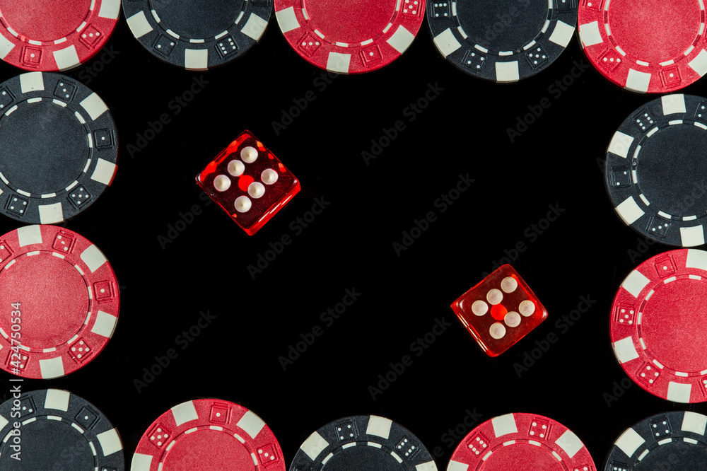 Red dice with a maximum winning combination of twelve in Craps on black table and chips Red dice with a maximum winning combination of twelve in Craps on black table and chips