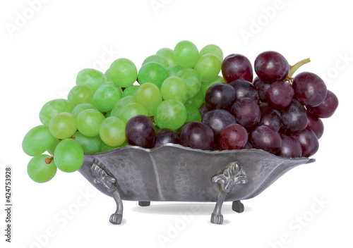 red green grapes on a gray plate isolate