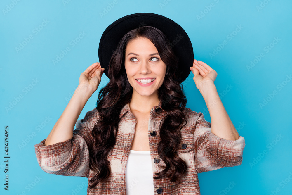 Photo of dreamy inspired lady look up empty space wear checkered jacket headwear isolated blue background Photo of dreamy inspired lady look up empty space wear checkered jacket headwear isolated blue background