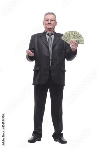 Studio shot of businessman holding fanned out money