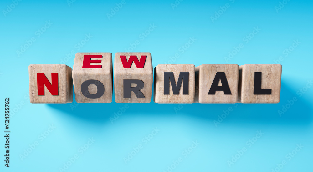 Wooden cubes with message NEW NORMAL on blue background Wooden cubes with message NEW NORMAL on blue background