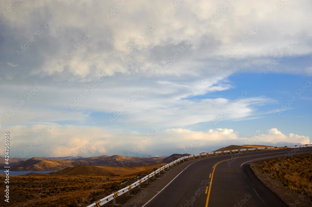 Landscape with a sunset view of the road through altiplano, Peru. Landscape with a sunset view of the road through altiplano, Peru.