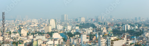 HO CHI MINH CITY, VIETNAM - DEC 26, 2020: Panoramic view of the densely populated city of Ho Chi Minh City with polluted air