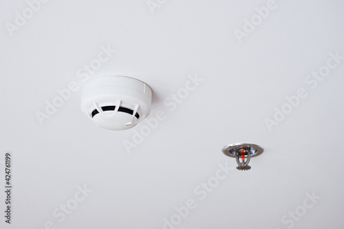 Water sprinkler and Smoke detectors sensor, Automatic fire extinguishing systems on white background with copy space, Installed inside the buildings to prevent fire for safety of life and property.