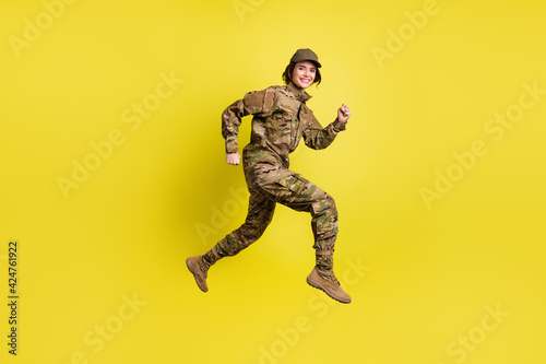 Full body profile photo of charming carefree person hurry beaming smile isolated on yellow color background
