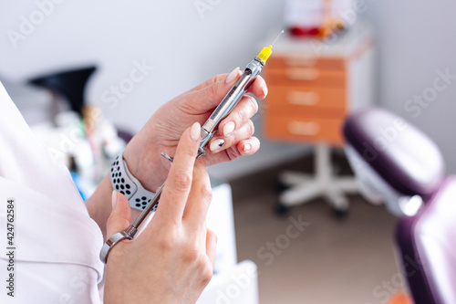 Wallpaper Mural Female hands with a syringe for injection. Vaccination. Torontodigital.ca