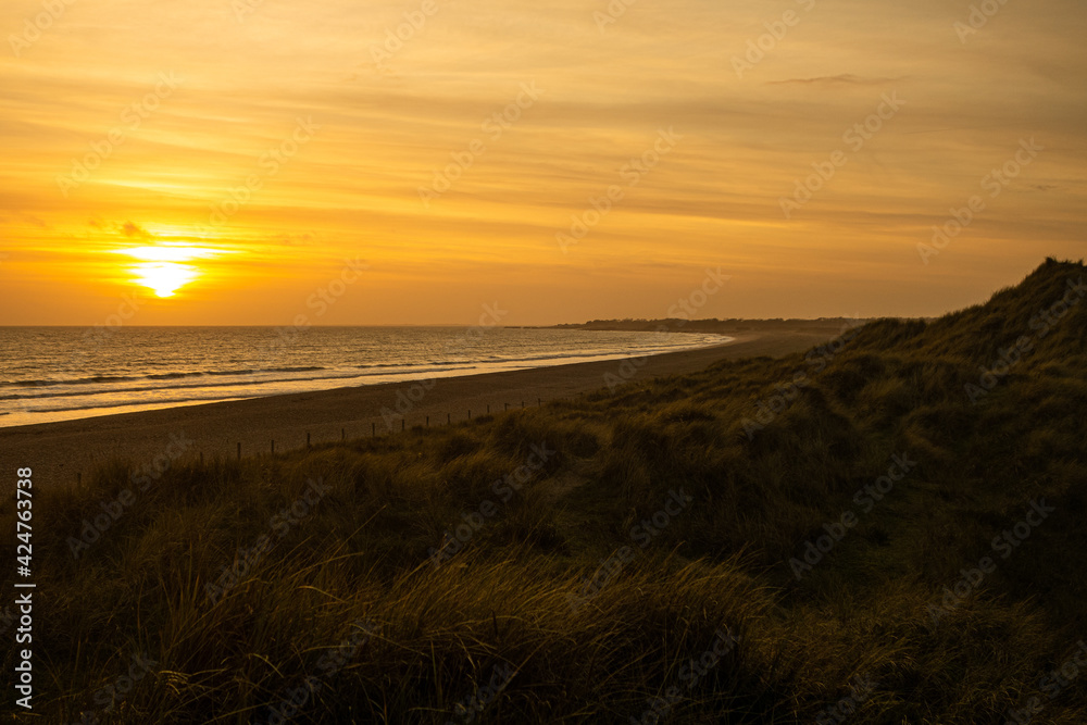 Sunset over the Sand Dunes on Littlehampton's West Beach, looking West towards Bognor Regis. Sunset over the Sand Dunes on Littlehampton's West Beach, looking West towards Bognor Regis.