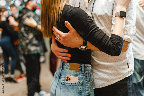 Kharkiv, Ukraine 12.03.21 Man and woman are dancing passionately bachata at party photo