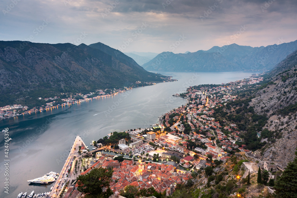 Kotor Bay and Old Town illumiinated at dusk seen from St John's Fortress and hilltop,Montenegro,Eastern Europe.