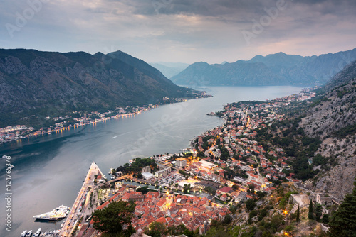 Kotor Bay and Old Town illumiinated at dusk seen from St John's Fortress and hilltop,Montenegro,Eastern Europe. photo