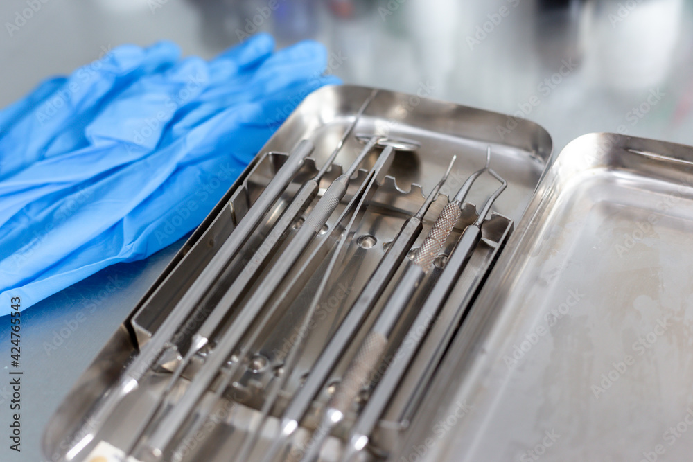 Dental instruments and medical gloves on the table Dental instruments and medical gloves on the table