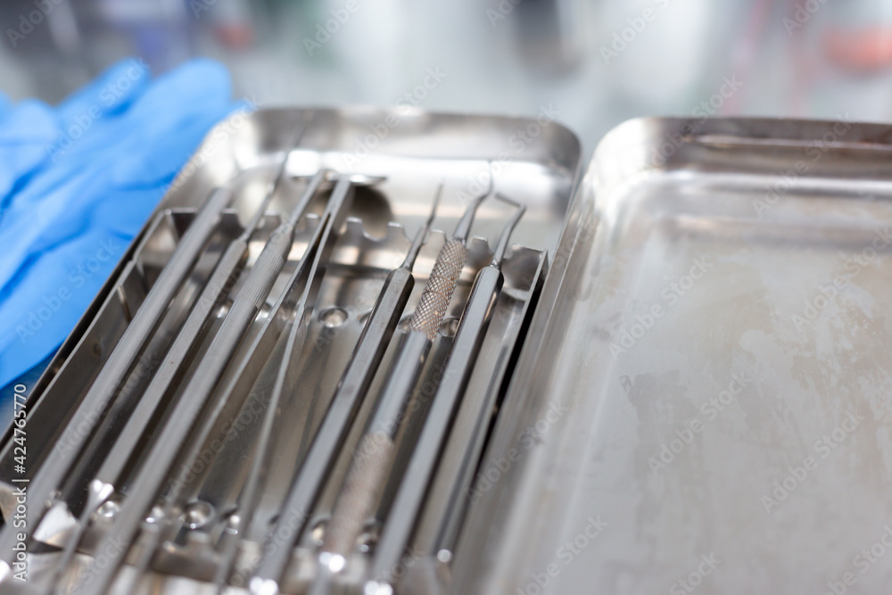 Dental instruments and medical gloves on the table Dental instruments and medical gloves on the table