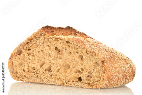 One half of a loaf of bread, close-up, isolated on white.