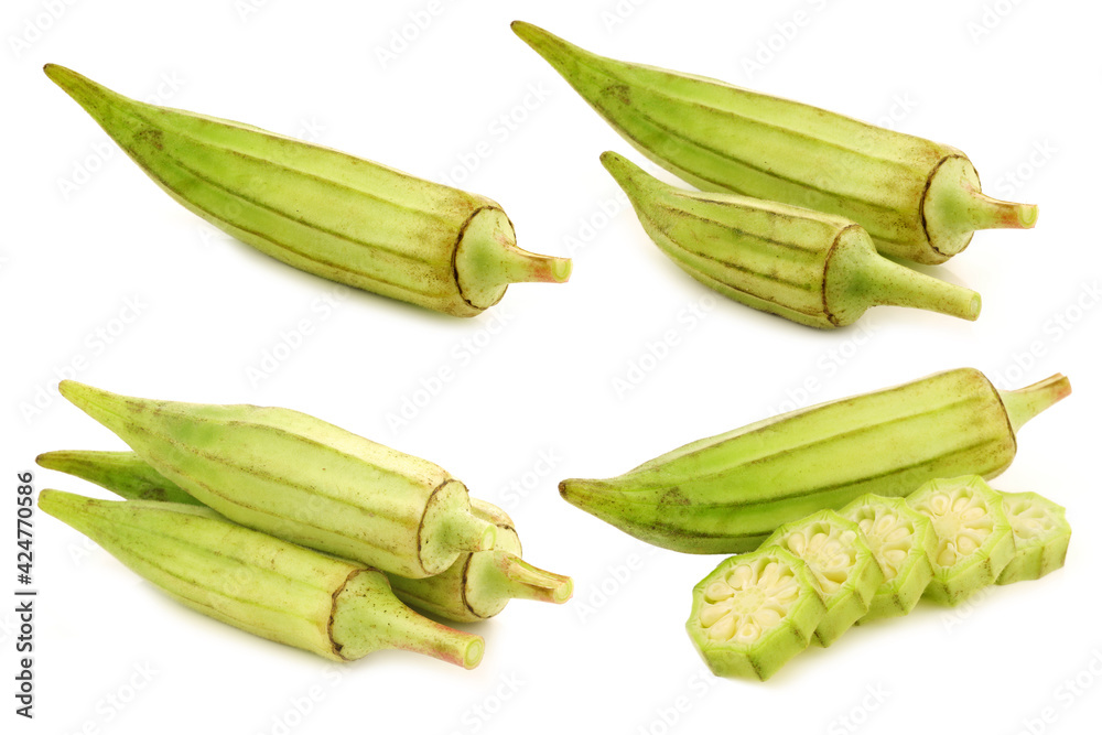 fresh raw okra pods (Abelmoschus esculentus) and a cut one on a white background fresh raw okra pods (Abelmoschus esculentus) and a cut one on a white background