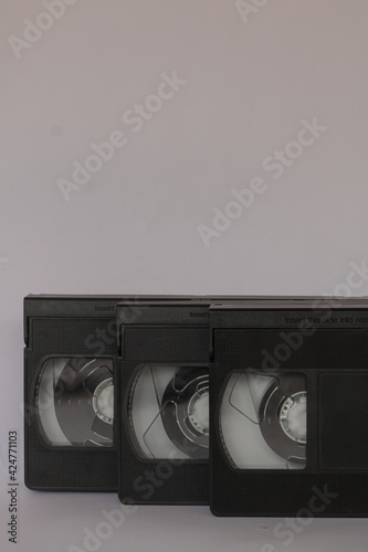 Three VHS Video Tapes, Cassette, isolated on white background. Vintage, Retro concept with tapes used in the past to play and record film and footage. copy space for text © Nodi