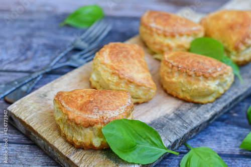 Fresh baked home made  Mini cheese puff pastries.Cheese pie with phyllo pastry and herbs