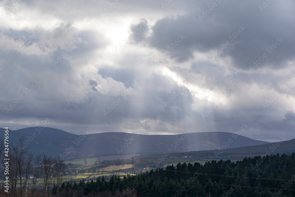 Crepuscular rays and clouds over the Wicklow mountains.
