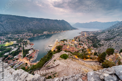 Kotor Bay and Old Town illumiinated at dusk seen from St John's Fortress and hilltop,Montenegro,Eastern Europe. photo