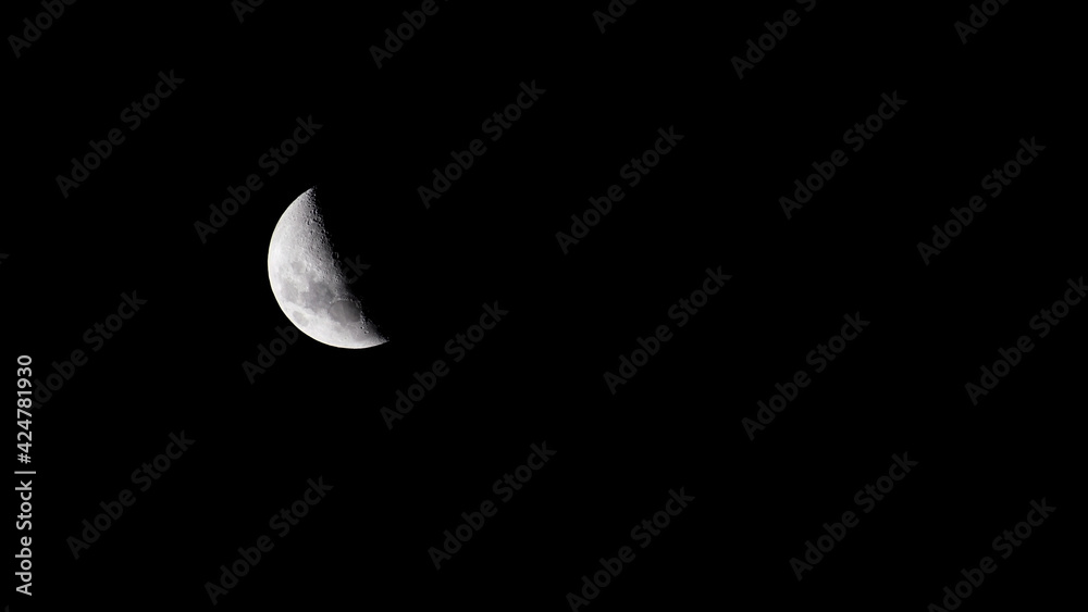 Third Quarter moon in a dark and clean sky Third Quarter moon in a dark and clean sky
