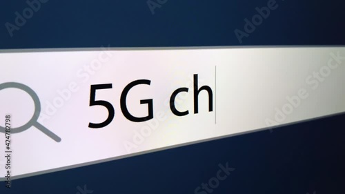 5G chipping written in search bar with cursor, computer monitor, close-up with camera zoom effect