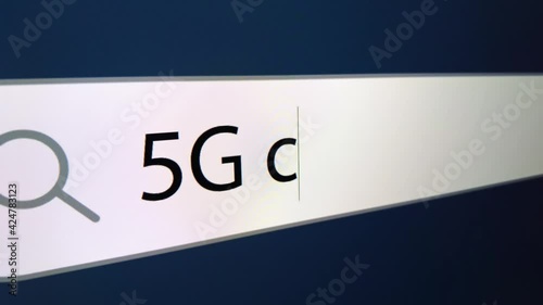 5G chipping written in search bar with cursor, computer monitor, close-up with camera zoom effect