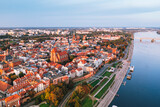 Aerial view of Torun city with Vistula river during sunset , Poland 