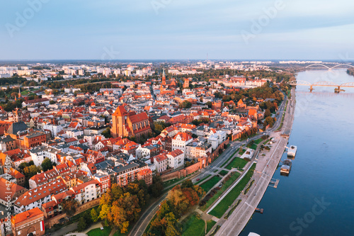 Aerial view of Torun city with Vistula river during sunset , Poland  photo