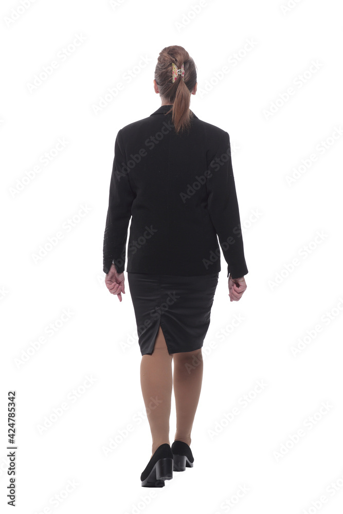 Back view of walking business woman in black suit