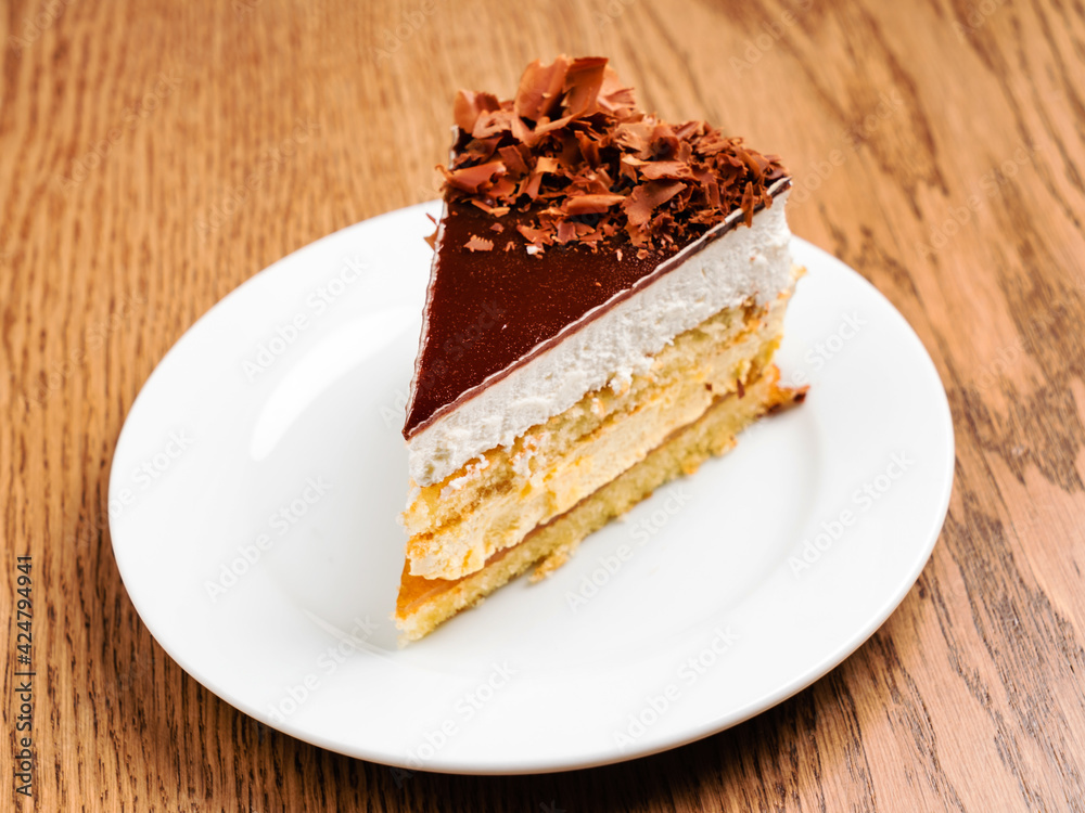 slice of chocolate cake on white plate slice of chocolate cake on white plate