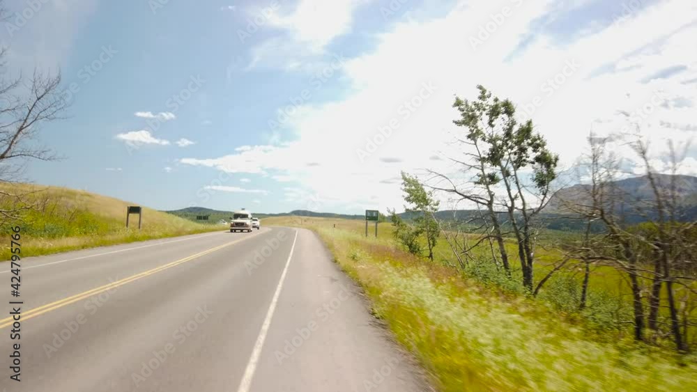 WATERTON, AB, CANADA - JULY 2019: Smooth & cinematic gimbal driving views of Waterton National Park WATERTON, AB, CANADA - JULY 2019: Smooth & cinematic gimbal driving views of Waterton National Park