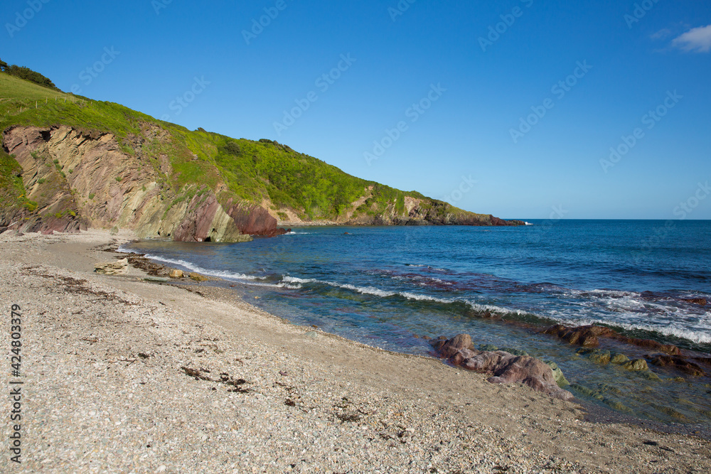Talland Bay beach Cornwall England UK with blue sea and waves Talland Bay beach Cornwall England UK with blue sea and waves