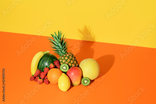 Tropical fruits isolated on a colored background. Fresh summer fruits.