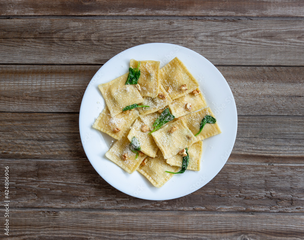 Ravioli with ricotta cheese, spinach and nuts. Healthy eating. Vegetarian food. Italian cuisine.