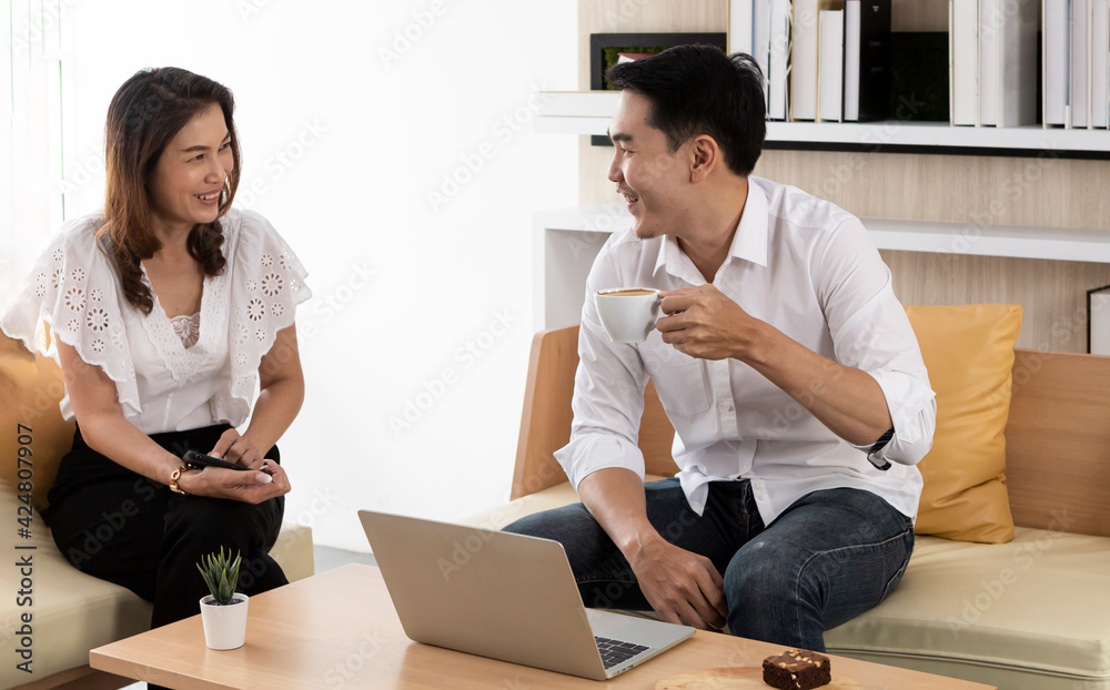 Young attractive couple in coffee shop. Couple having meeting in coffee shop. Smiling young couple in a coffee shop using computer. Young man and woman in a restaurant talking. Young attractive couple in coffee shop. Couple having meeting in coffee shop. Smiling young couple in a coffee shop using computer. Young man and woman in a restaurant talking.