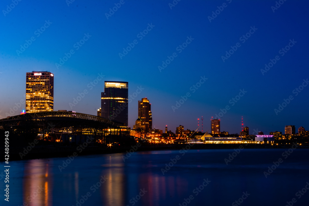 Night City of Milwaukee skyline along shoreline of Lake Michigan