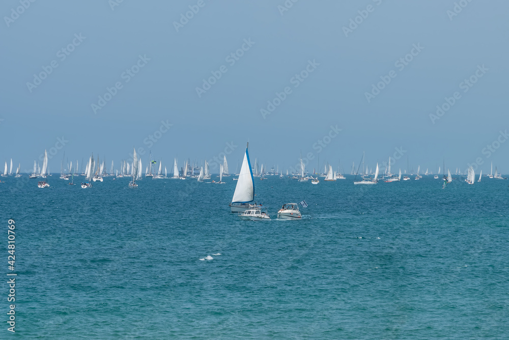 Colorful sea landscape with yachts and motor boats, clear azure water of Mediterranean sea in Tel Aviv, Israel