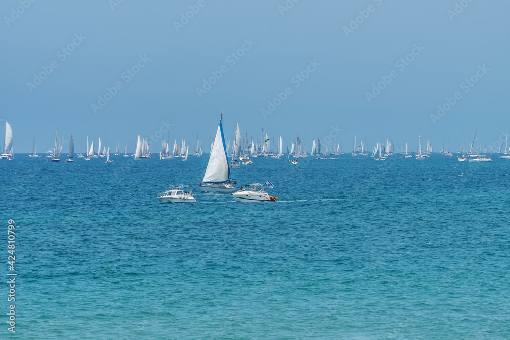 Colorful sea landscape with yachts and motor boats, clear azure water of Mediterranean sea in Tel Aviv. Panorama view