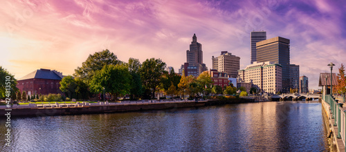 Providence, Rhode Island, United States. Panoramic view of a modern downtown city skyline on the Atlantic Ocean East Coast. Colorful Sunset Sky Art Render. photo